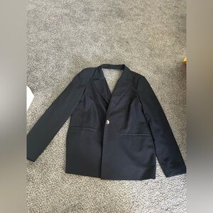 Women’s size 8 open back black blazer. Never worn.